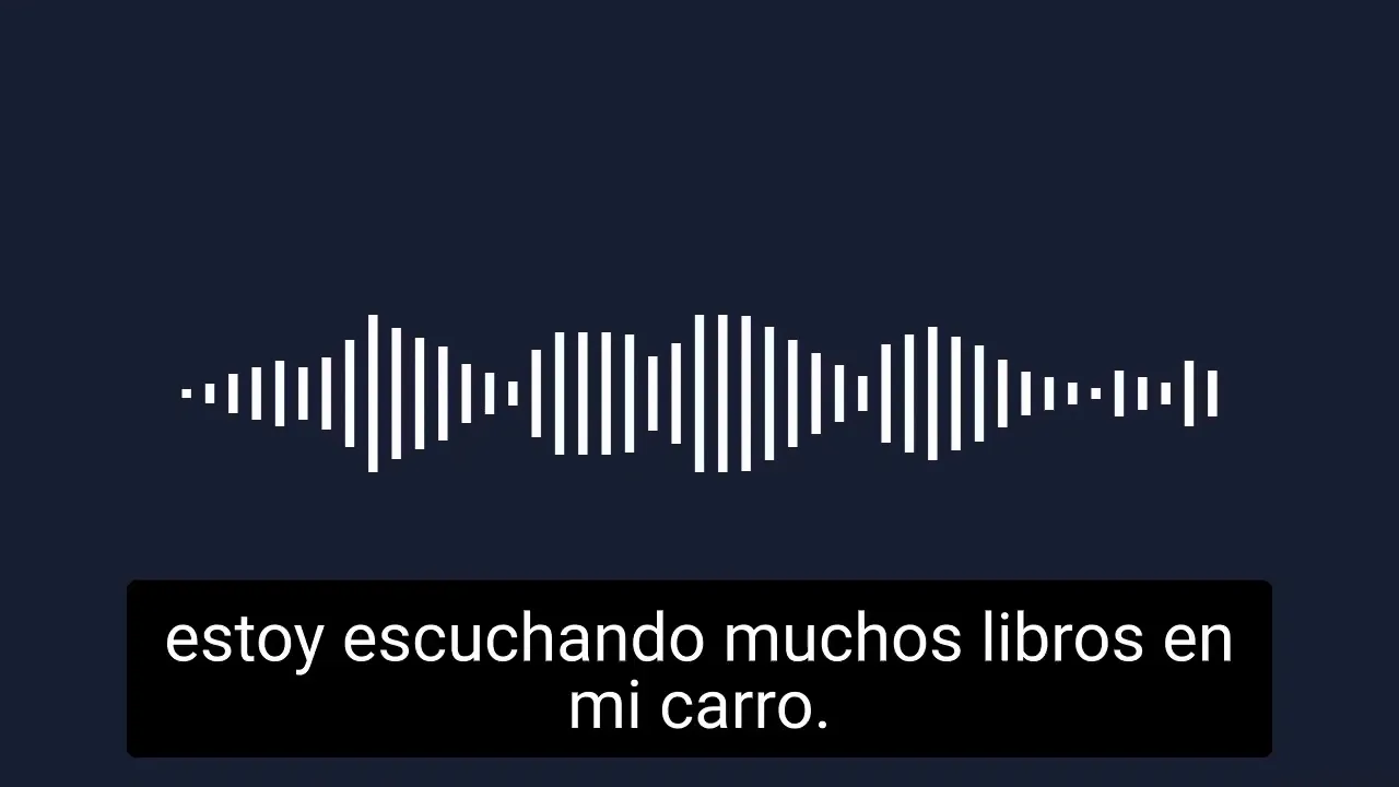 Audio waveform with subtitle 'estoy escuchando muchos libros en mi carro.' on a dark background